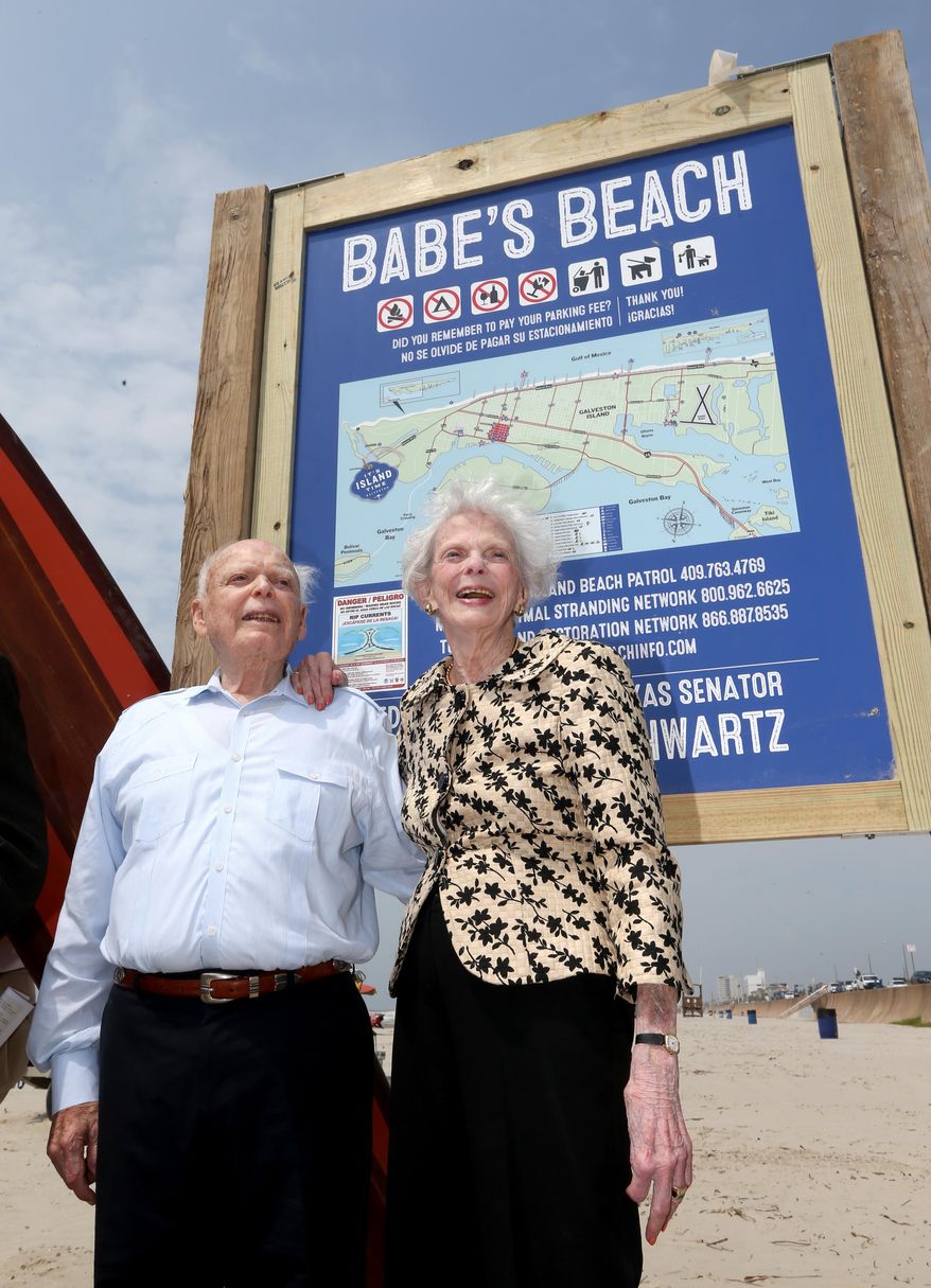 Former Texas Senator A.R. "Babe" Schwartz and his wife, Marilyn, pose for photos Thursday, May 26, 2016, during the dedication of Babe's Beach in Galveston, Texas. Schwartz is working to find ways for the Galveston Park Board to cooperate with other beach communities to restore money taken away by the Legislature in 2015. He believes access to public beaches has been under constant assault since the day the Open Beaches Act was enacted in 1959. (Jennifer Reynolds/The Galveston County Daily News via AP)