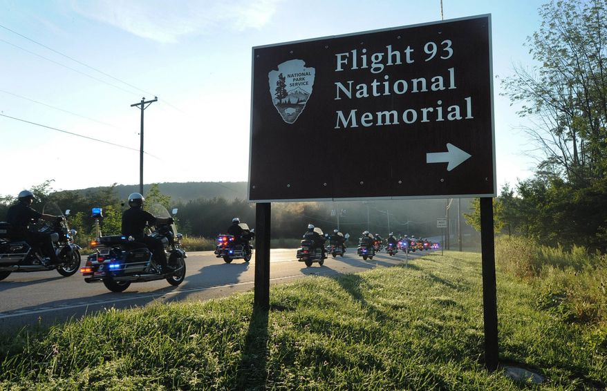 Motorcycles pass a sign near the Flight 93 National Memorial near Shanksville, Pa., on Aug. 19, 2016. The America's 911 Ride begins at the Flight 93 crash site near Shanksville, and continues through Cumberland and Hagerstown, Md., before heading south through Leesburg, Va., to a hotel near the Pentagon. Organizer Ted Sjurseth says the 16th annual ride will be the last. (John Rucosky/The Tribune-Democrat via AP)