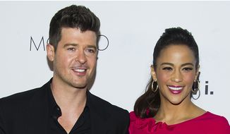 Robin Thicke first met actress Paula Patton in 1991 at an under-21 hip-hop club on the Sunset Strip in Los Angeles, when he asked her to dance. According to Thicke, he sang Stevie Wonder&#x27;s &quot;Jungle Fever&quot; to her as they danced. Thicke began dating Patton at the age of 16. They were married in 2005, and have a son, Julian Fuego Thicke, born in 2010. Thicke and Patton separated in February 2014, after 21 years together and almost nine years of marriage. On October 9, 2014, Paula Patton officially filed for divorce. The divorce was finalized on March 20, 2015. (AP Photo)