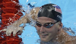 In this Aug. 2, 2016, file photo, United States James Feigen smiles during a swimming training session prior to the 2016 Summer Olympics in Rio de Janeiro, Brazil. Feigen was one of four American Olympic swimmers in connection to a story of being held at gunpoint and robbed several hours after the last Olympic swimming races ended. That claim began to unravel when police said that investigators could not find evidence to substantiate it. (AP Photo/Matt Slocum, File)