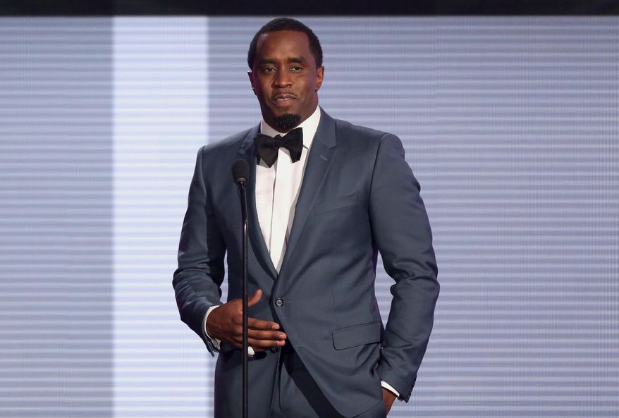 FILE - In this Nov. 22, 2015 file photo, Sean &amp;quot;Diddy&amp;quot; Combs presents the award for best collaboration of the year at the American Music Awards at the Microsoft Theater in Los Angeles. Combs will be kicking off his tour later than expected after undergoing surgery for a shoulder injury. The rapper and business mogul announced Friday, Aug. 19, 2016, that his Bad Boy Family Reunion Tour will now begin Sept. 1 in Chicago to give him more time to recover from surgery. (Photo by Matt Sayles/Invision/AP, File)