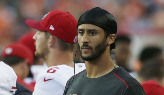San Francisco 49ers quarterback Colin Kaepernick holds a tablet computer as he stands on the sideline during the first half of a preseason NFL football game against the Denver Broncos, Saturday, Aug. 20, 2016, in Denver. (AP Photo/Joe Mahoney) **FILE**