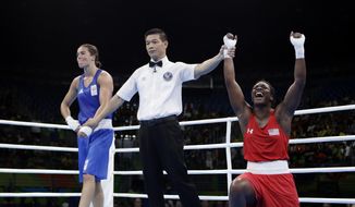 United States&#39; Claressa Maria Shields, right, reacts as she won her gold medal for the women&#39;s middleweight 75-kg boxing against Netherlands&#39; Nouchka Fontijn at the 2016 Summer Olympics in Rio de Janeiro, Brazil, Sunday, Aug. 21, 2016. (AP Photo/Frank Franklin II)