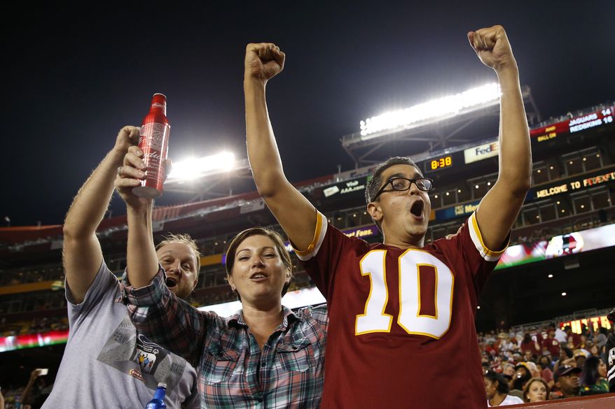 Washington Redskins fans cheer during the second half of an NFL preseason football game against the Jacksonville Jaguars in Landover, Md., Thursday, Sept. 3, 2015. (AP Photo/Alex Brandon) **FILE**
