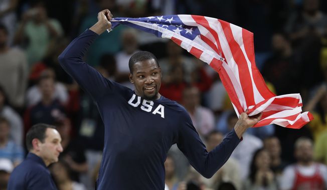 United States&#x27; Kevin Durant (5) celebrates winning the men&#x27;s basketball gold medal at the 2016 Summer Olympics in Rio de Janeiro, Brazil, Sunday, Aug. 21, 2016. (AP Photo/Eric Gay)