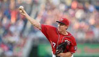 While he said he can &quot;gut it through,&quot; Washington Nationals pitcher Stephen Strasburg was put on the 15-day disabled list Monday with a sore right elbow. (Associated Press)