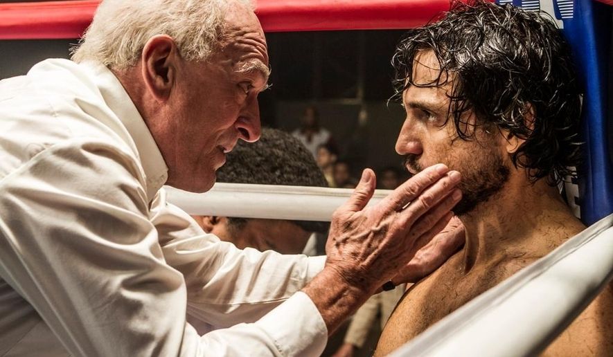 This image released by The Weinstein Company shows Robert De Niro, left, and Edgar Ramirez in a scene from, "Hands of Stone." (Rico Torres/The Weinstein Company via AP)