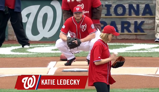 Katie Ledecky preparing to toss out the ceremonial first pitch at Game One of the NLDS in Nationals Park in 2014. The Bethesda, Md., native will throw out the first pitch at the Orioles-Nationals game in Nats Park on Wednesday, August 24, 2016. Image via MLB.com video screen grab.