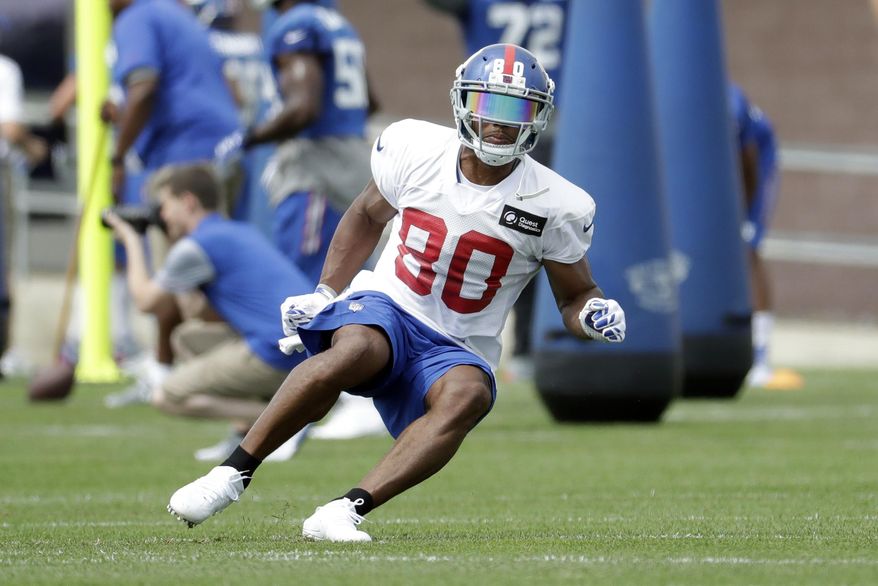 FILE - In tis July 30, 2016, file photo, New York Giants wide receiver Victor Cruz runs a drill during NFL football training camp in East Rutherford, N.J. Cruz returned to practice Tuesday, Aug. 23, 2016, for the Giants and earned the Odell Beckham Jr. seal of approval. It marked the first time in almost two weeks that the oft-injured 29-year-old wide receiver practiced with the team, and slightly increases the hope he will be able to resume his career after two frustrating seasons. (AP Photo/Julio Cortez, File)