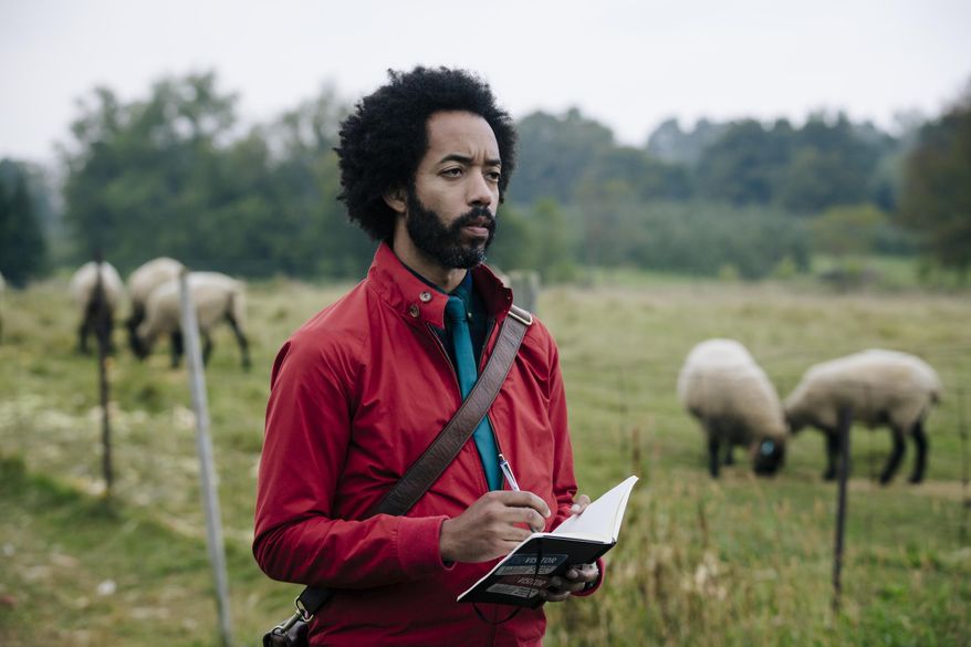 This image released by TBS shows Wyatt Cenac in a scene from "People of Earth," premiering on Oct. 31. (Jan Thijs/TBS via AP)