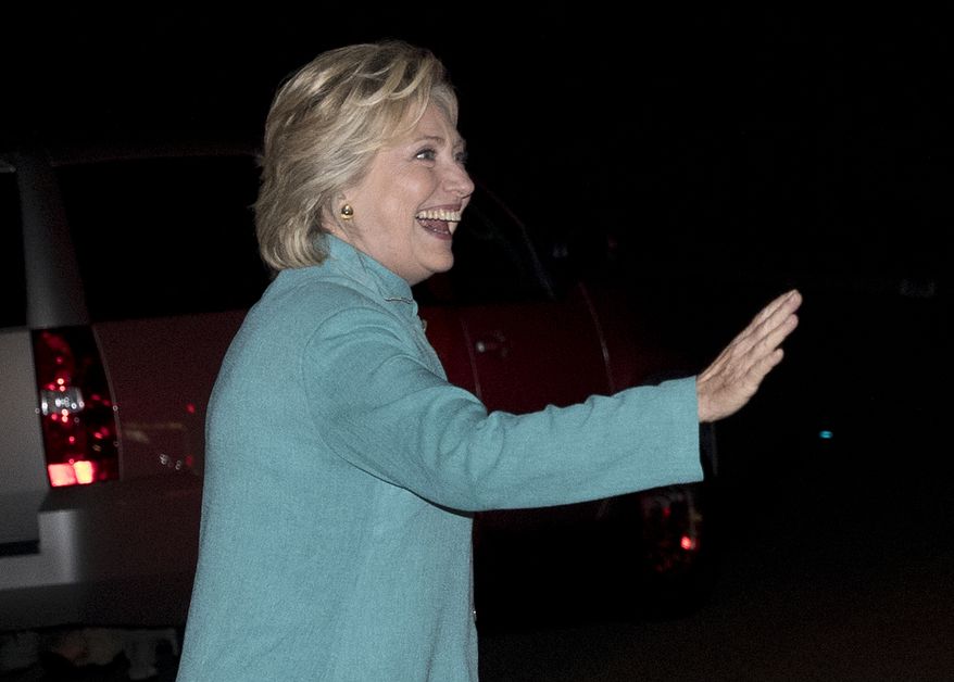 Democratic presidential nominee Hillary Clinton walks to greet people on the street as she leaves a fundraiser in Piedmont, Calif., Tuesday, Aug. 23, 2016. (AP Photo/Carolyn Kaster)