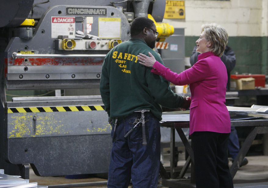 Hillary Rodham Clinton greets a worker as she tours the factory of William J. Donovan sheet metal contractors in Philadelphia, Tuesday, April 1, 2008. (AP Photo/Charles Dharapak)