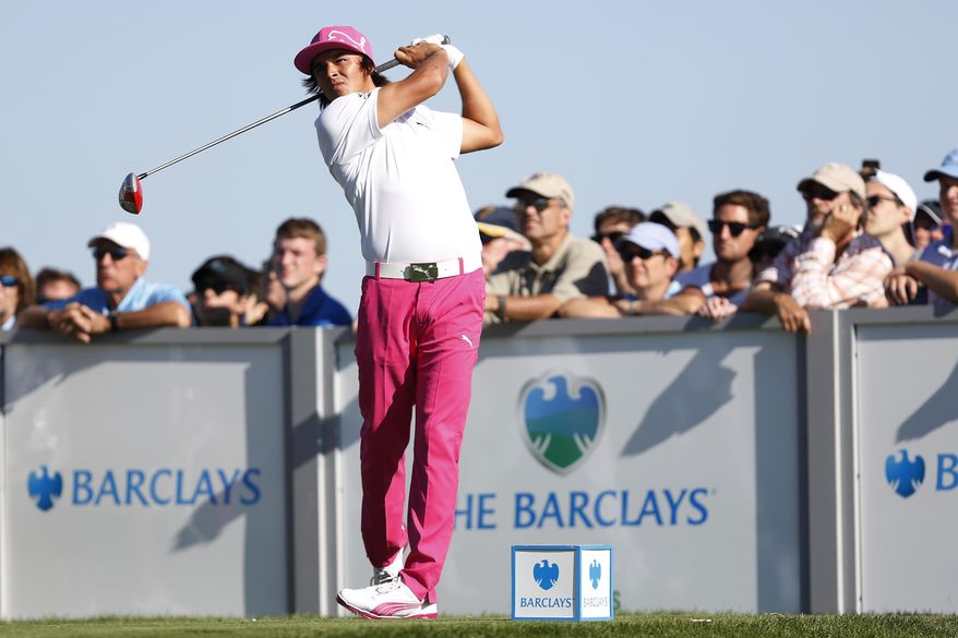 IFLE - In this Aug. 23, 2013, file photo, Rickie Fowler hits a tee shot on the 17th hole during the third round of The Barclays golf tournament in Jersey City, N.J. So much more is at stake than $69 million in prize and bonus money during the FedEx Cup. The Barclays is the first postseason event, the start of deciding Ryder Cup teams and who gets voted player of the year. (AP Photo/John Minchillo, File)