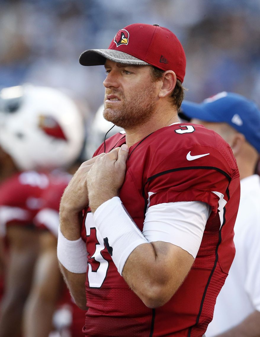 FILE - In this Aug. 19, 2016, file photo, Arizona Cardinals quarterback Carson Palmer stands on the sideline during the first half of a preseason NFL football game against the San Diego Chargers, in San Diego. Palmer and the rest of the first-team Arizona had a tough night in San Diego, but the Cardinals quarterback is certain the team will get rolling once games count for real. (AP Photo/Rick Scuteri, File)