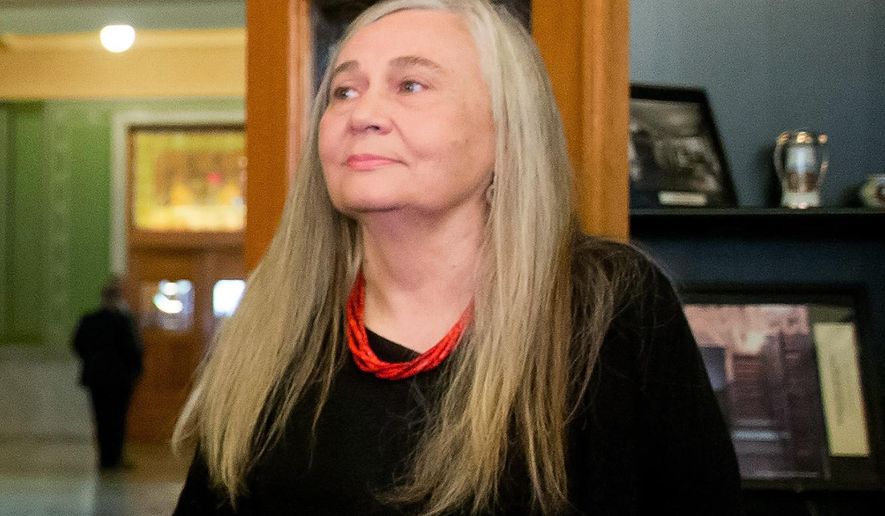 FILE - In this Sept. 14, 2015, file photo, Pulitzer Prize-winning writer Marilynne Robinson visits the State Library of Iowa in the Ola Babcock Miller Building in Des Moines, Iowa. On Wednesday, Aug. 24, 2016, Dayton Literary Peace Prize organizers announced Robinson as the recipient of the annual Richard C. Holbrooke Distinguished Achievement Award, to be presented at a Nov. 20, 2016, ceremony in Dayton, Ohio. The lifetime achievement award celebrates the power of literature to foster peace, social justice and global understanding. (AP Photo/Andrew Harnik, File)