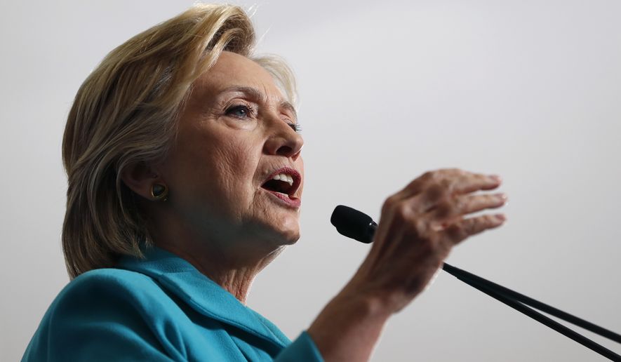 Hillary Clinton said Donald Trump has shown by whom he hires, what he tweets, how he attacked President Obama&#39;s birth, his stance on immigration and the attraction white nationalists have for him that he is the most dangerous major-party candidate in modern history. (Associated Press)