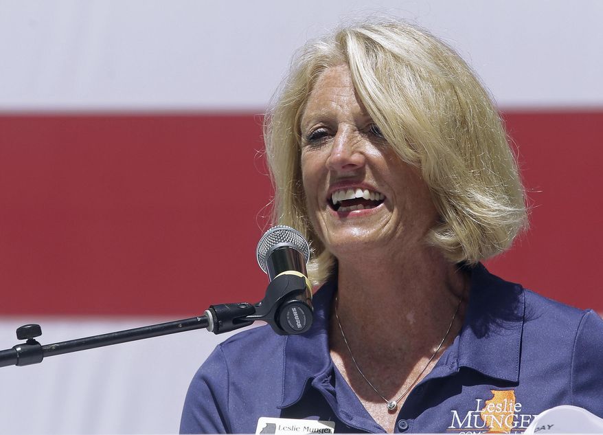 FILE - In this Aug. 17, 2016, file photo, Illinois state Comptroller Leslie Munger speaks to supporters during Governor;s Day at the Illinois State Fair in Springfield, Ill. Munger faces democrat Susan Mendoza in the November general election. Mendoza face republican incumbent Comptroller Leslie Munger in the November general election. The pair met Thursday Aug. 25, 2016 with the Chicago Tribune's editorial board. The candidates are working to show their independence from Republican Gov. Bruce Rauner and Democratic House Speaker Michael Madigan. (AP Photo/Seth Perlman, File)