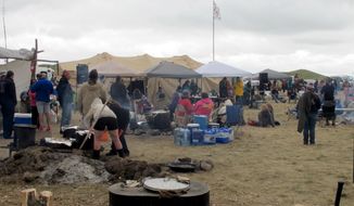 People protesting the construction on a four-state oil pipeline at a site in southern North Dakota gather at campground near the Standing Rock Sioux reservation on Thursday, Aug. 25, 2016. About 300 people were at the campsite where protesters from across the country and members of 60 tribes have gathered in opposition to the $3.8 billion Dakota Access pipeline that will pass through Iowa, Illinois, North Dakota and South Dakota. (AP Photo/James MacPherson)