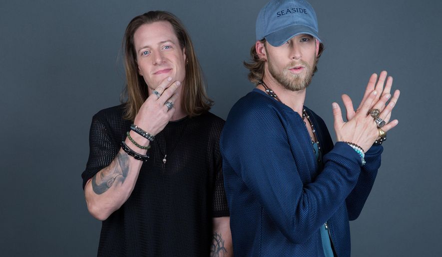 Tyler Hubbard, left, and Brian Kelley of Florida Georgia Line pose for a portrait on Thursday, Aug. 25, 2016, in New York. (Photo by Amy Sussman/Invision/AP)