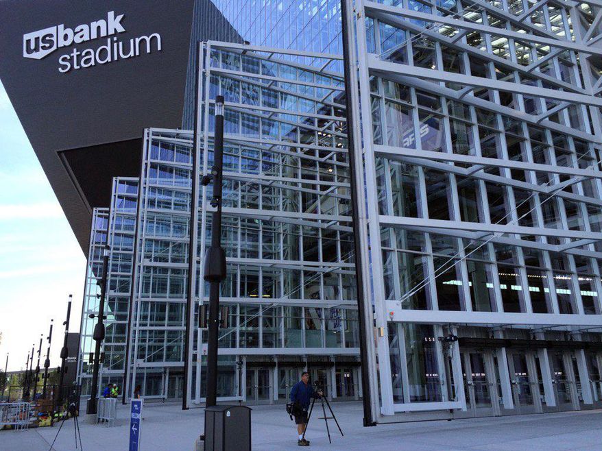 U.S. Bank Stadium's huge doors opened for the first time Friday, Aug. 26, 2016, in Minneapolis. The Minnesota Vikings' new stadium has been taken for a couple of test drives by soccer players and country music stars, but its biggest test yet arrives Sunday when the football team and its rabid fans finally arrive. (Rochelle Olson /Star Tribune via AP)