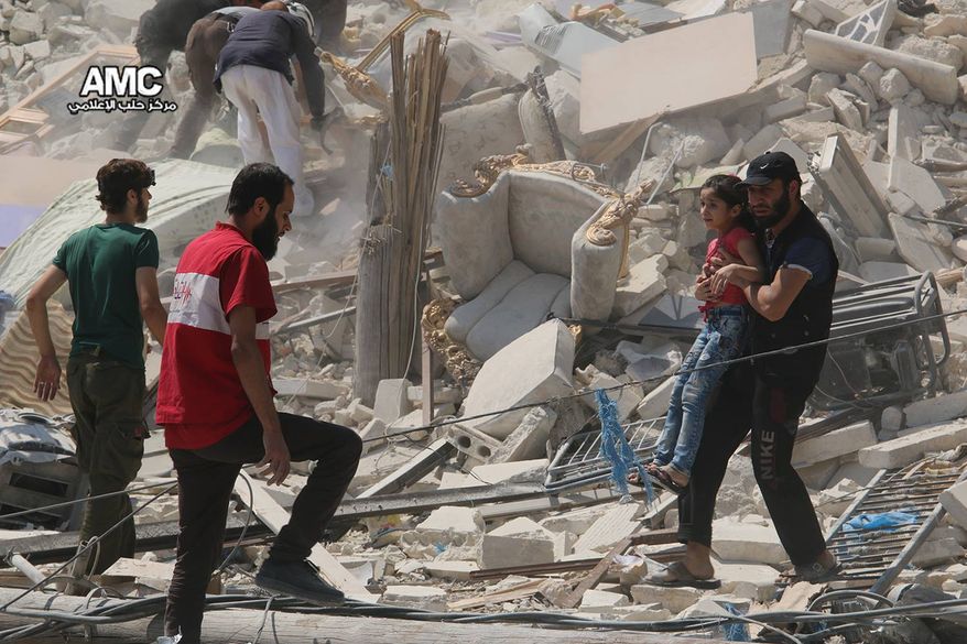 This photo provided by the Syrian anti-government activist group Aleppo Media Center (AMC), shows a Syrian man carrying a girl away from the rubble of a destroyed building after barrel bombs were dropped on the Bab al-Nairab neighborhood in Aleppo, Syria, Saturday, Aug. 27, 2016. Syria activists said, at least 15 civilians have been killed when suspected government helicopters dropped barrel bombs on a wake for children killed in earlier airstrikes in rebel-held Aleppo. (Aleppo Media Center via AP)