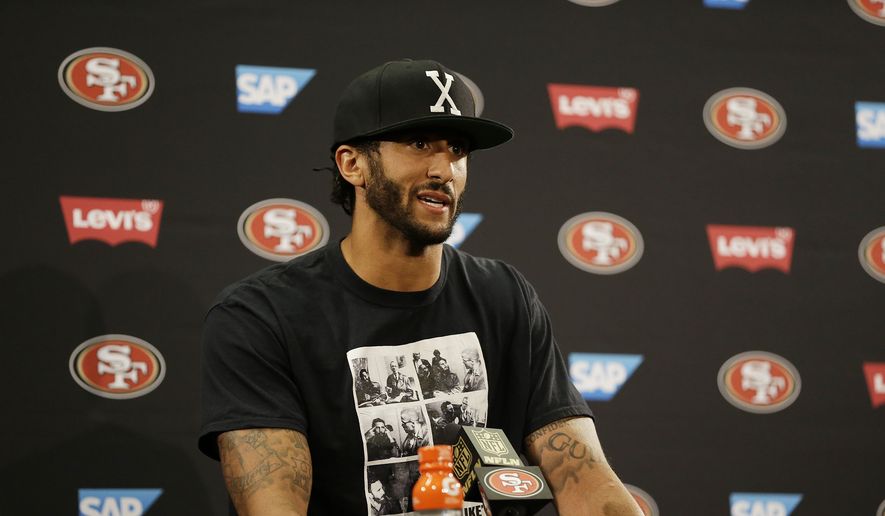 San Francisco 49ers quarterback Colin Kaepernick sat on the bench during Friday&#x27;s national anthem at Levi&#x27;s Stadium, a decision he told NFL Media is based on the United States oppressing African-Americans and other minorities. (Associated Press)
