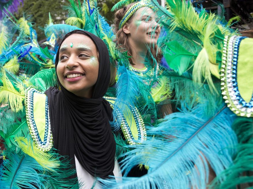 Dancers perform during the Children's Day parade at the Notting Hill Carnival in west London, Sunday, Aug. 28, 2016. (Isabel Infantes/PA via AP)