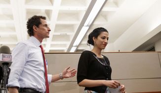 New York City mayoral candidate Anthony Weiner and his wife Huma leave a press conference at the Gay Men&#39;s Health Crisis headquarters, Tuesday, July 23, 2013, in New York. (AP Photo/Kathy Willens) ** FILE **