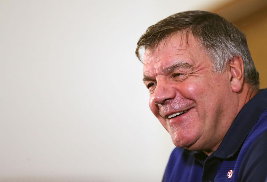 England soccer team manager Sam Allardyce, smiles during the press conference at St George's Park, Burton central England Monday Aug. 29, 2016. England will play Slovakia in a World Cup qualifying group match in Slovakia on Sunday. (Simon Cooper/PA via AP)