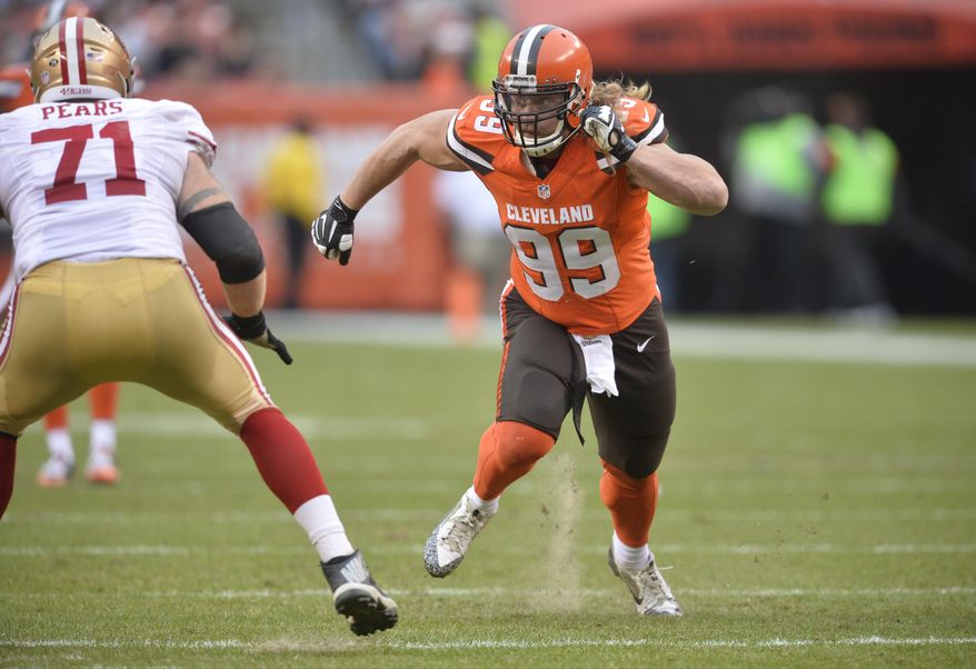 FILE - In this Dec. 13, 2015, file photo, Cleveland Browns outside linebacker Paul Kruger (99) rushes the passer against the San Francisco 49ers during an NFL football game, in Cleveland. The Browns have released linebacker Paul Kruger, a startling move in another step in the team's youth movement.Kruger started 46 games and made 18 sacks in three seasons for Cleveland and was considered one of the team's leaders. At left is 49ers' Erik Pears (71). (AP Photo/David Richard, File)