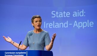 European Union Competition Commissioner Margrethe Vestager speaks during a media conference at EU headquarters in Brussels on Tuesday, Aug. 30, 2016. The European Union says Ireland has given illegal tax benefits to Apple Inc. and must now recover the unpaid back taxes from the U.S. technology company, plus interest. (AP Photo/Virginia Mayo)