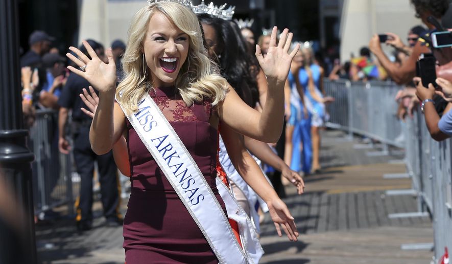 Miss Arkansas, Savvy Shields waves during Miss America Pageant arrival ceremonies Tuesday, Aug. 30, 2016, in Atlantic City. The contestants from all 50 states, the District of Columbia and Puerto Rico appeared at the traditional welcoming ceremony across from Boardwalk Hall. (AP Photo/Mel Evans) )