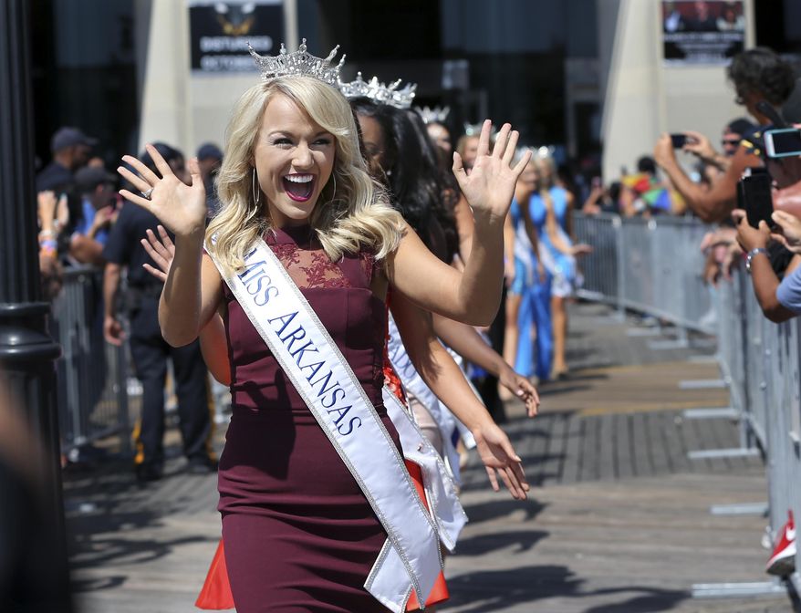 Miss Arkansas, Savvy Shields waves during Miss America Pageant arrival ceremonies Tuesday, Aug. 30, 2016, in Atlantic City. The contestants from all 50 states, the District of Columbia and Puerto Rico appeared at the traditional welcoming ceremony across from Boardwalk Hall. (AP Photo/Mel Evans) )