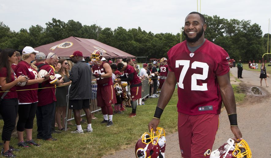 Washington Redskins defensive end Anthony Lanier (72) carries helmets as he walks from the field during the NFL football teams minicamp at the Redskins Park in Ashburn, Va., Wednesday, June 15, 2016. (AP Photo/Manuel Balce Ceneta)
