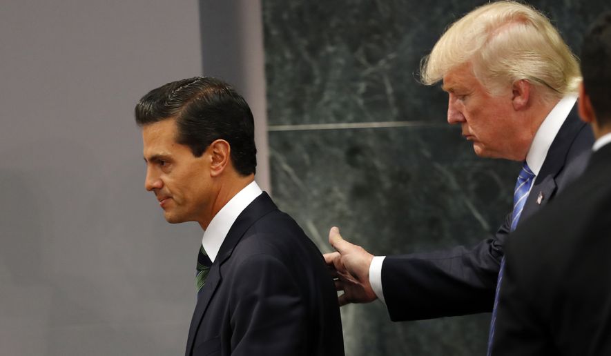 Republican presidential nominee Donald Trump walks with Mexico President Enrique Pena Nieto at the end of their joint statement at Los Pinos, the presidential official residence, in Mexico City, Wednesday, Aug. 31, 2016. Trump is calling his surprise visit to Mexico City Wednesday a &#39;great honor.&#39;  The Republican presidential nominee said after meeting with Pe&amp;#241;a Nieto that the pair had a substantive, direct and constructive exchange of ideas.(AP Photo/Dario Lopez-Mills)