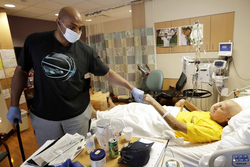 CORRECTS FROM MD ANDERSON HOSPITAL TO MD ANDERSON CANCER CENTER -NBA Hall of Fame member and TNT colleague Charles Barkley left, bumps fists with sportscaster Craig Sager after visiting Sager Tuesday, Aug. 30, 2016, at MD Anderson Cancer Center in Houston. Sager underwent his third bone marrow transplant Wednesday, Aug. 31, 2016, as he continues to battle acute myeloid leukemia. (AP Photo/David J. Phillip)