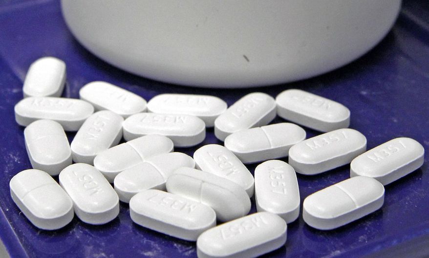 FILE - This Tuesday, Feb. 19, 2013, file photo shows pills of the painkiller hydrocodone at a pharmacy in Montpelier, Vt. The Food and Drug Administration said Wednesday, Aug. 31, 2016, that the agency will issue new warnings about the potentially fatal consequences of mixing prescription painkillers and popular sedatives like Valium and Xanax, including coma and death. (AP Photo/Toby Talbot, File)