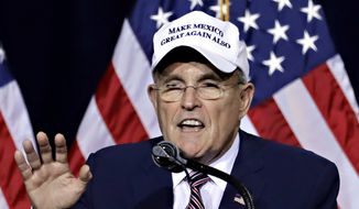Former mayor of New York CIty Rudy Giuliani, wears a &quot;Make Mexico Great Again Also&quot; hat prior to Republican presidential candidate Donald Trump&#x27;s speech during a campaign rally at the Phoenix Convention Center, Wednesday, Aug. 31, 2016, in Phoenix. (AP Photo/Matt York)