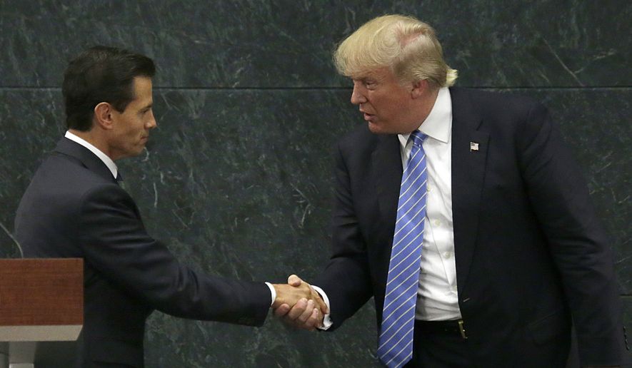 In this Aug. 31, 2016, photo, Mexico&#39;s President Enrique Pena Nieto and Republican presidential nominee Donald Trump shake hands after a joint statement at Los Pinos, the presidential official residence, in Mexico City. (AP Photo/Marco Ugarte)
