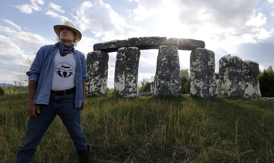 Mark Cline stands before "Foamhendge", his full-sized foam and fiberglass recreation of Stonehendge, located on Rt. 11 near Natural Bridge, Va., Tuesday, April 26, 2016. The Natural Bridge historic area will become part of the state parks system in the near future and Cline has been told to move the sculpture. Foamhenge is getting a new home. The offbeat Rockbridge County attraction has been sold and eventually will be relocated to a family farm near Centreville in Northern Virginia, said Mark Cline, the artist who created and maintained Foamhenge. (Bob Brown/Richmond Times-Dispatch via AP)