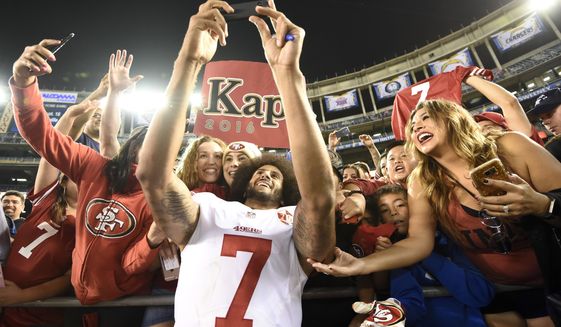 San Francisco 49ers quarterback Colin Kaepernick greets fans after their 31-21 win against the San Diego Chargers during an NFL preseason football game Thursday, Sept. 1, 2016, in San Diego.  (AP Photo/Denis Poroy)