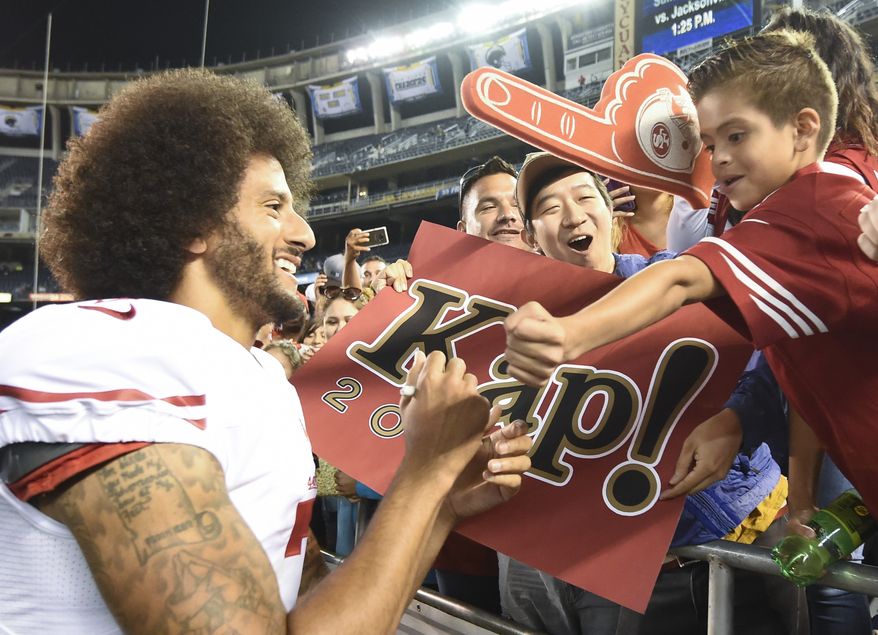 San Francisco 49ers quarterback Colin Kaepernick greets fans after their 21-31 win against the San Diego Chargers during an NFL preseason football game Thursday, Sept. 1, 2016, in San Diego.  (AP Photo/Denis Poroy)