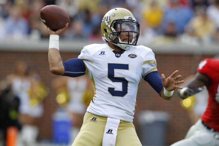 FILE - In this Nov. 28, 2015, file photo, Georgia Tech quarterback Justin Thomas passes against Georgia in the second half of an NCAA college football game in Atlanta, Ga. Thomas is determined to go out in style his final year. The senior leads the Yellow Jackets into their season opener Saturday, Sept. 3, 2016, against Boston College in Dublin, Ireland. (AP Photo/Brett Davis, File)