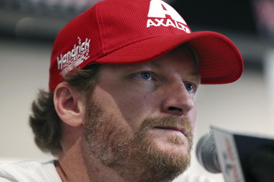 In this Aug. 5, 2016, photo, Dale Earnhardt Jr. listens to a question about his concussion while addressing the media at Watkins Glen International racetrack in Watkins Glen, N.Y. Earnhardt will miss the rest of the NASCAR season as he continues to recover from a concussion. (AP Photo/Mel Evans, File)
