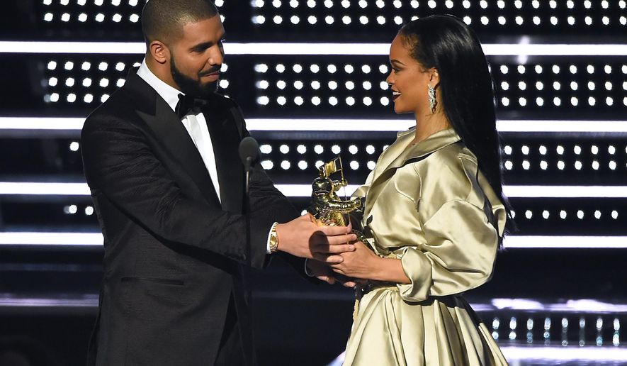 FILE - In this Aug. 28, 2016, file photo, Drake, left, presents the Michael Jackson Video Vanguard Award to Rihanna at the MTV Video Music Awards at Madison Square Garden in New York. Rihanna thanked Drake on Instagram Friday, Sept. 2, 2016, for his presentation, calling the rapper's speech "touching." (Photo by Charles Sykes/Invision/AP, File)