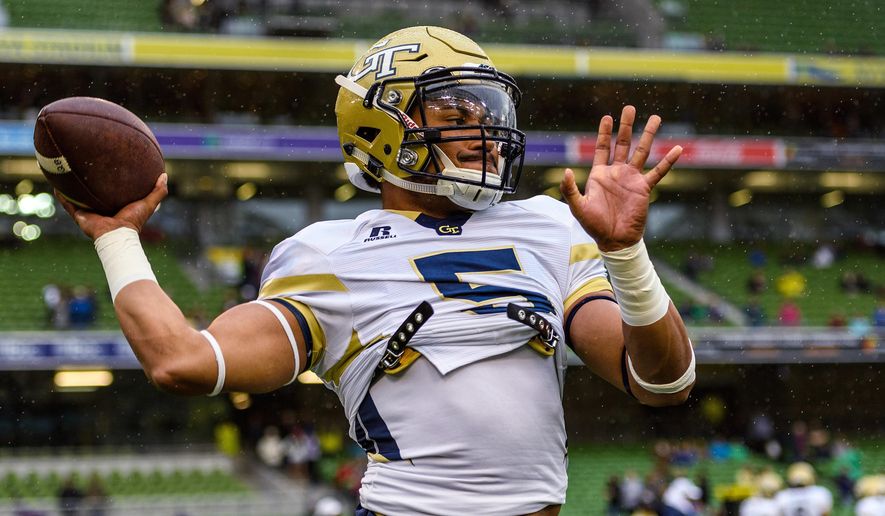 In this photo released by Georgia Tech, Georgia Tech Quarterback Justin Thomas (5) warms up before the first half of an NCAA football game between Boston College and Georgia Tech, Saturday, Sept. 3, 2016, in Dublin, Ireland. (Danny Karnik/Georgia Tech via AP)