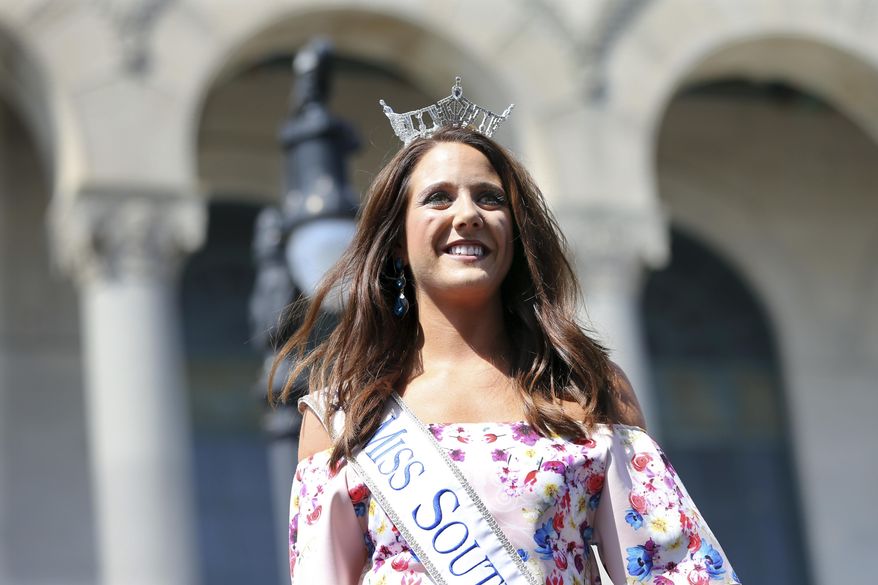 In this Tuesday, Aug. 30, 2016 photograph, Miss South Dakota, Julia Olson is introduced during Miss America Pageant arrival ceremonies in Atlantic City. Olson, says her dad told her she had 'lost puppy syndrome,' always wanting to help someone in trouble. Her dream is to meet former NFL quarterback Tim Tebow and travel to the Philippines to serve at one of his orphanages. (AP Photo/Mel Evans)