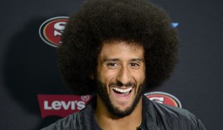 In the couple of weeks since San Francisco 49ers quarterback Colin Kaepernick created a national firestorm by refusing to stand for “The Star-Spangled Banner,” his official jersey has become the biggest seller on the team. (Associated Press)
