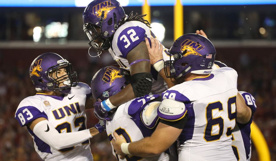 Northern Iowa running back Tyvis Smith is hoisted into the air by his teammates after scoring a touchdown during the first half of an NCAA college football game against Iowa State, Saturday, Sept. 3, 2016, in Ames, Iowa. (AP Photo/Justin Hayworth)