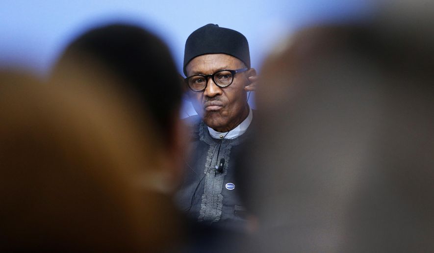 FILE- In this Thursday, May 12, 2016 file photo, Nigeria President Muhammadu Buhari listens during a panel discussion at the Anti-Corruption Summit in London, England. Nigeria's military says some officers are selling arms and ammunition to Boko Haram, indicating the corruption bedeviling the country's fight against the Islamic extremists continues despite government efforts to halt graft. The admission comes three weeks after the Nigerian army said a military tribunal is trying 16 officers and troops accused of offenses related to the fight against Boko Haram, including the theft and sale of ammunition. (AP Photo/Frank Augstein, Pool, File)